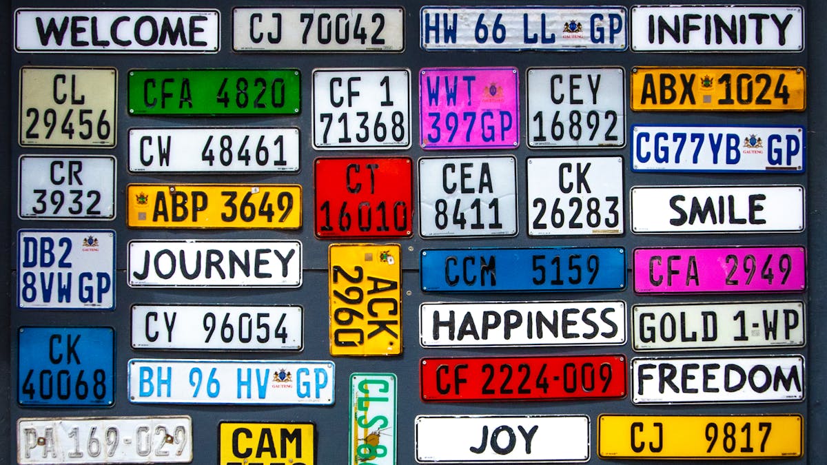Various license plates with numbers and words.