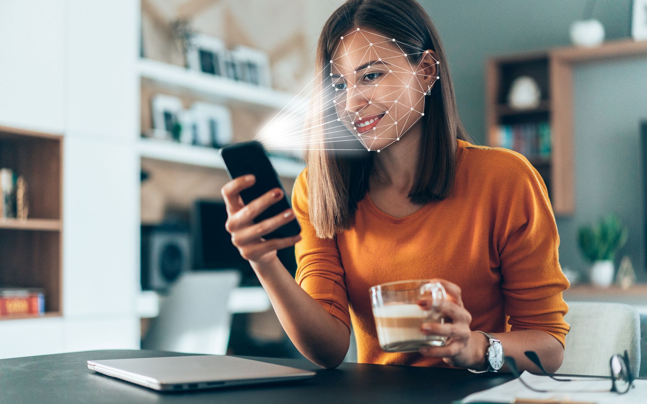 Facial recognition software, on a phone, scanning a woman's face.